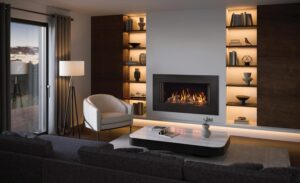 Onyx Avanti 85 Gas inset fire expression frame with white walls, dark brown acccent wall with display lighting, and wood floor.